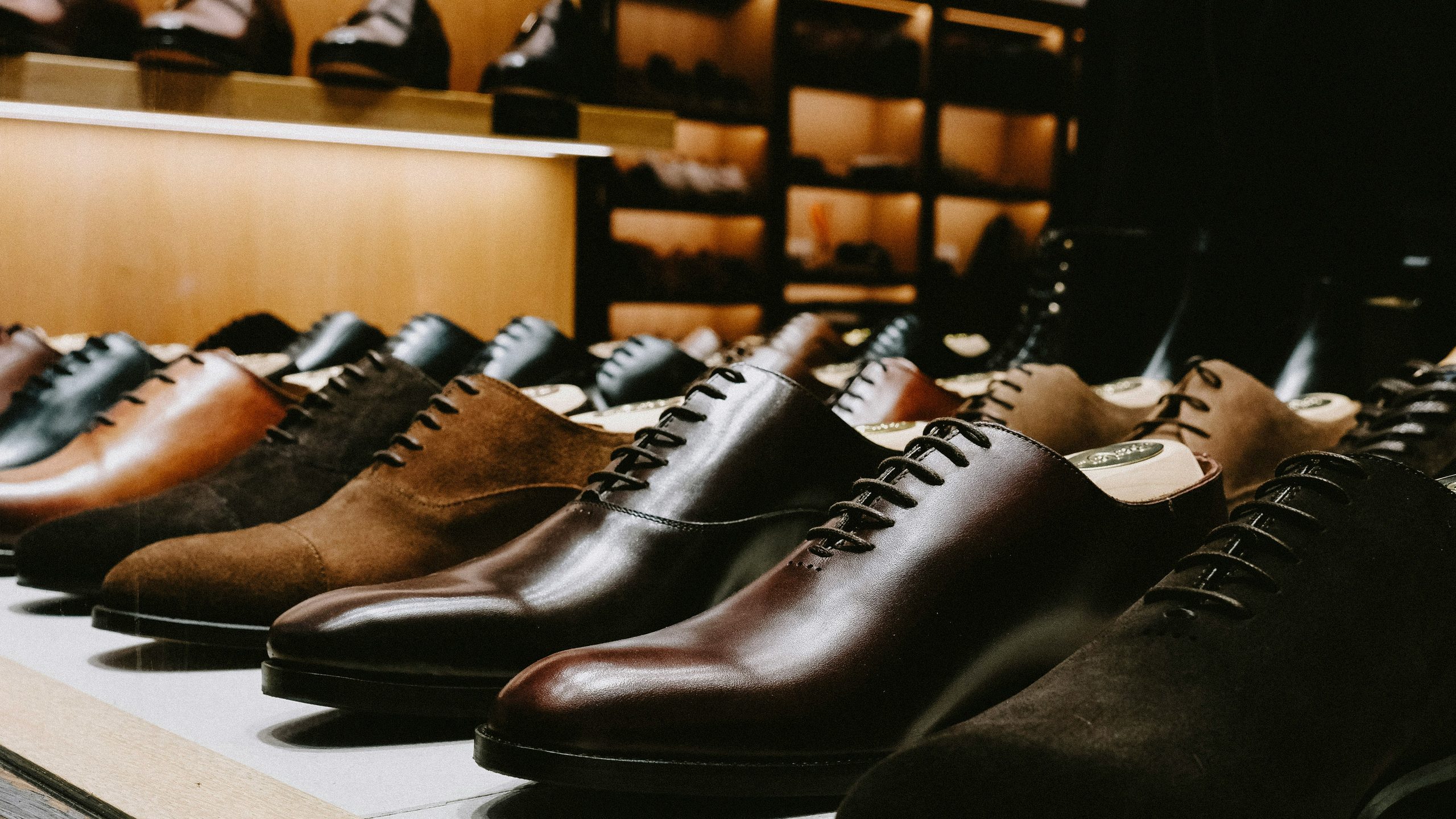 Handcrafted leather shoes lined up in the Truemans London atelier
